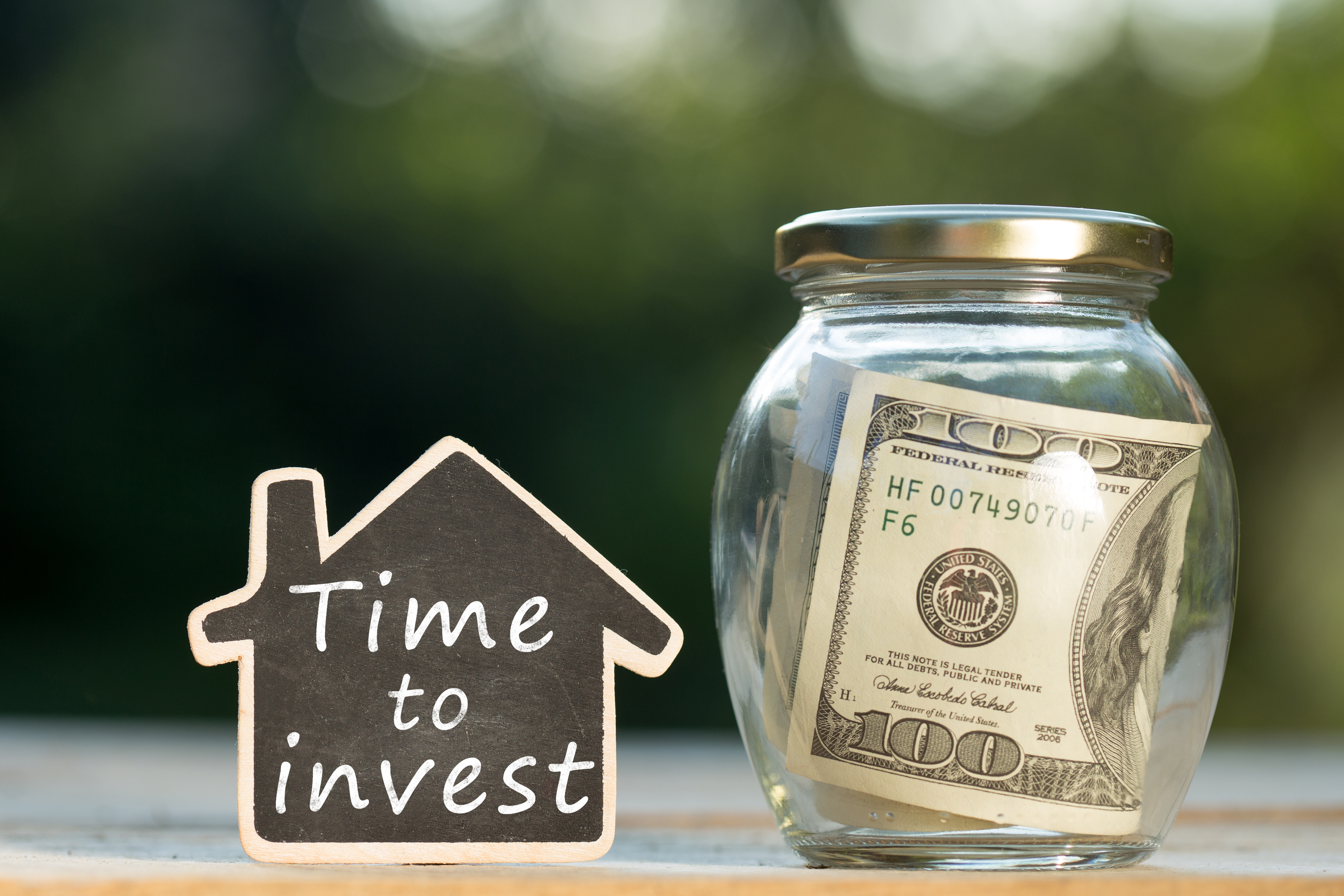 time to invest one-hundred-dollar bill in jar