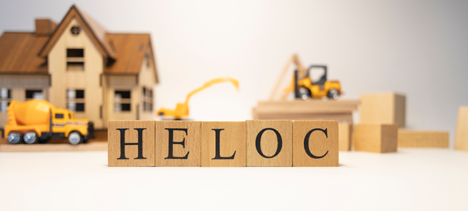 HELCO spelled out with toy wooden blocks