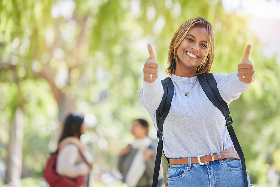 Young woman giving two thumbs up