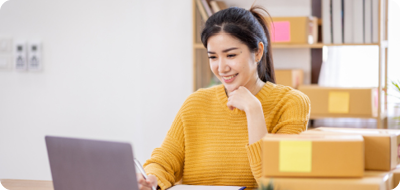 Woman working at desk on laptop