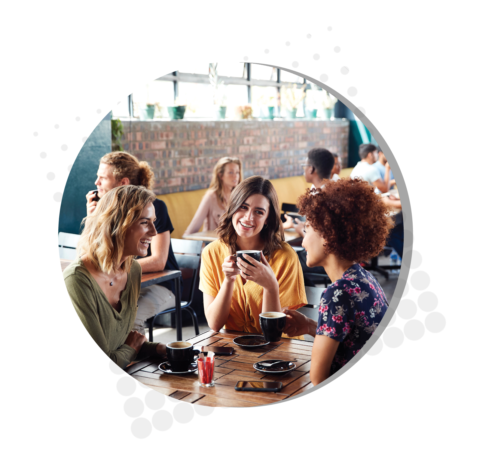 Three Young Female Friends Meeting Sit At Table In Coffee Shop And Talk