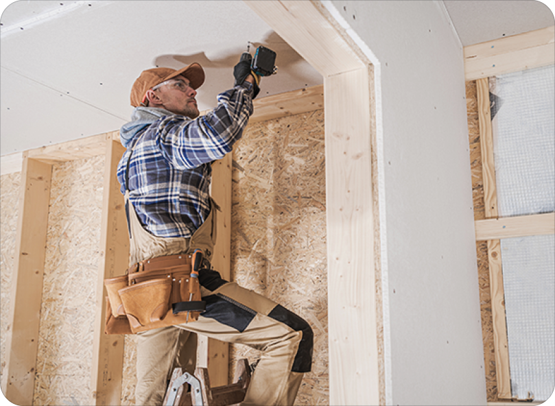 General Construction Contractor Worker Attaching Drywall Using Drill Driver