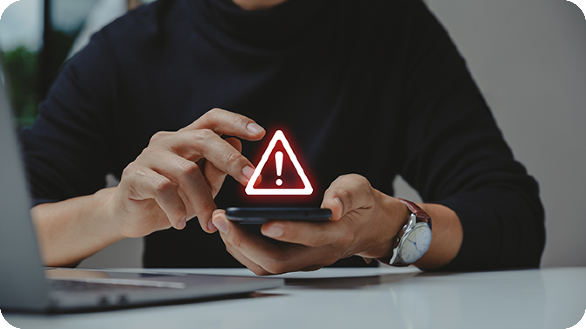 man holding phone in hands tapping on screen with alert sign hovering above