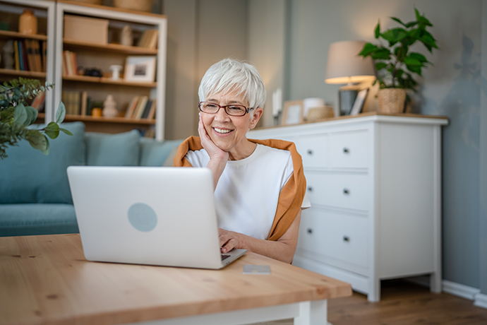 Senior woman use laptop computer at home for work