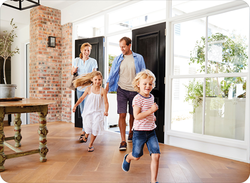 Young family arriving back to their home