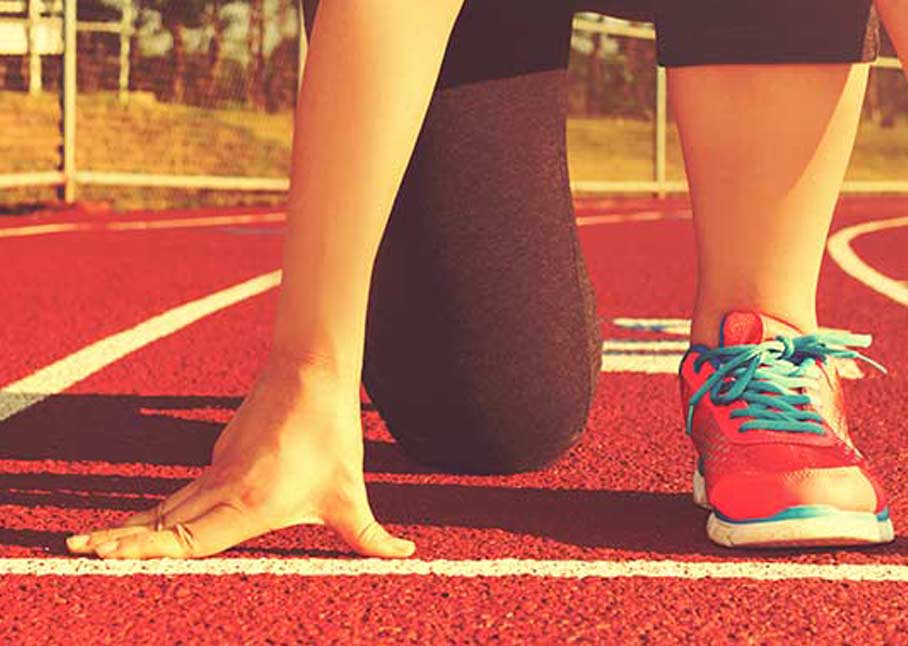 athletic shoes at starting line on track