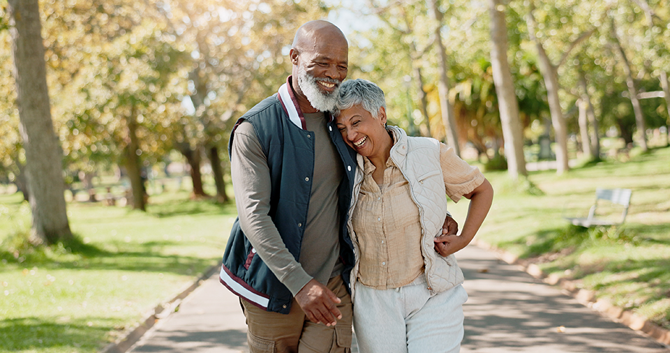 Loving senior couple in the park for a walk Loving senior couple in the park for a walk
