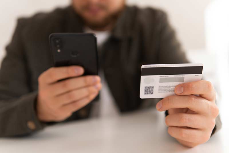 man holding credit card