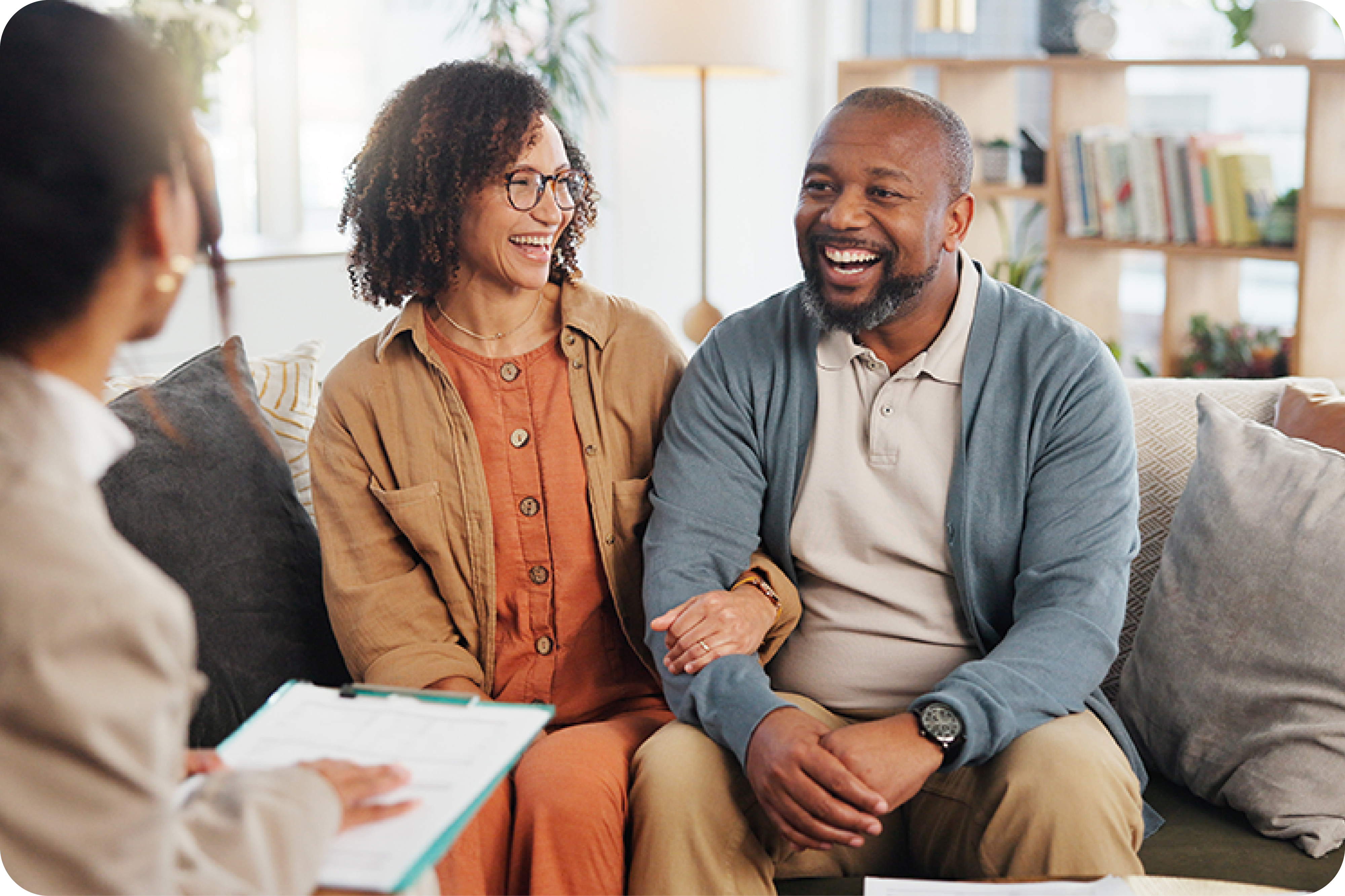 Happy couple having meeting with business woman Happy couple having meeting with business woman