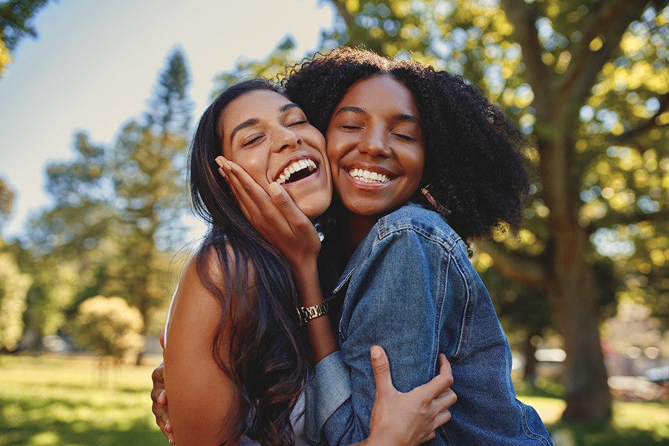 two best friends smiling and hugging two best friends smiling and hugging